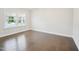 Bright bedroom with natural light, hardwood floors, and neutral color palette at 514 Bonville Ct, Fuquay Varina, NC 27526