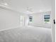 Bright bedroom with trey ceiling, fan, neutral walls and plush gray carpeting at 514 Bonville Ct, Fuquay Varina, NC 27526