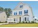 Charming two-story home with a well-manicured lawn and attached two car garage at 514 Bonville Ct, Fuquay Varina, NC 27526