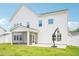 Rear exterior of a home with white siding and a screened in porch at 514 Bonville Ct, Fuquay Varina, NC 27526
