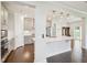 Bright open kitchen with hardwood floors, a large island, and stainless steel appliances at 514 Bonville Ct, Fuquay Varina, NC 27526