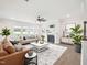 Inviting living room featuring stylish furniture, a fireplace, and ample natural light at 514 Bonville Ct, Fuquay Varina, NC 27526