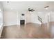 Spacious living room with hardwood floors, fireplace, ceiling fan and stairs to second floor at 514 Bonville Ct, Fuquay Varina, NC 27526