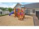 A wooden playground sits on a mulch bed and is enclosed by a fence at 514 Bonville Ct, Fuquay Varina, NC 27526