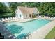 Inviting community pool surrounded by lounge chairs, offering a refreshing escape at 5501 Southern Cross Ave, Raleigh, NC 27606
