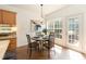 Bright dining area featuring a table, chairs, and natural light from a large window at 5501 Southern Cross Ave, Raleigh, NC 27606