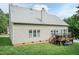 The back exterior shows the house, the yard, the deck, siding, and lots of windows at 5501 Southern Cross Ave, Raleigh, NC 27606