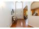 Bright foyer featuring hardwood floors, a front door, and a decorative bench at 5501 Southern Cross Ave, Raleigh, NC 27606