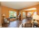 Comfortable living room showcasing natural light, hardwood floors, and a cozy aesthetic at 5501 Southern Cross Ave, Raleigh, NC 27606