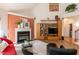 Inviting living room with a fireplace, entertainment center, and tile floors at 5501 Southern Cross Ave, Raleigh, NC 27606