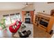 Bright and airy living room with a fireplace, vaulted ceiling, and large windows at 5501 Southern Cross Ave, Raleigh, NC 27606