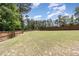Spacious backyard with a privacy fence, offering plenty of room for outdoor activities and recreation at 59 White Quartz Pl, Fuquay Varina, NC 27526