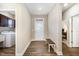 An inviting entryway with a bench offers seamless access to the laundry and other rooms at 59 White Quartz Pl, Fuquay Varina, NC 27526