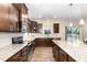 Spacious kitchen with stainless appliances, granite countertops, and an abundance of cabinet storage at 59 White Quartz Pl, Fuquay Varina, NC 27526