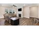 Inviting living room featuring a cozy fireplace, large windows, and comfortable seating arrangement at 59 White Quartz Pl, Fuquay Varina, NC 27526
