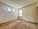 Comfortable carpeted bedroom featuring two bright windows for lots of sunlight at 5911 Endsley Ct, Raleigh, NC 27610