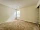 Cozy carpeted bedroom with a large window and ample closet space at 5911 Endsley Ct, Raleigh, NC 27610
