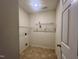 Utility room featuring shelving and practical tile flooring at 5911 Endsley Ct, Raleigh, NC 27610