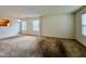 Spacious living room featuring two large windows and neutral-colored walls at 5911 Endsley Ct, Raleigh, NC 27610