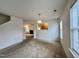 Inviting living room with plush carpeting, neutral walls, and lots of natural light at 5911 Endsley Ct, Raleigh, NC 27610