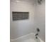 Modern shower with white subway tile and a built-in niche for toiletries at 6300 Nc 27, Coats, NC 27521