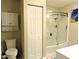 Full bathroom view showing the shower and toilet area, along with a storage cabinet, ideal for a clean and functional space at 8 Woodsprite Ct, Durham, NC 27703