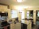 Functional kitchen featuring granite counters, ample cabinet space, and stainless steel appliances at 8 Woodsprite Ct, Durham, NC 27703