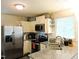 Well-lit kitchen with stainless steel appliances, granite countertops, and white cabinets at 8 Woodsprite Ct, Durham, NC 27703