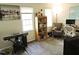 Well-lit office space featuring a gray upholstered chair, keyboard and built in bookcase, perfect for work or hobbies at 8 Woodsprite Ct, Durham, NC 27703