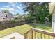 Private backyard featuring lush greenery and a wood fence at 809 Maple Shade Ln, Apex, NC 27502