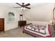 Cozy bedroom features a ceiling fan and a bright window at 809 Maple Shade Ln, Apex, NC 27502