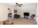 Cozy bonus room featuring a comfortable gray chair, flat screen tv and closet access to a bedroom at 809 Maple Shade Ln, Apex, NC 27502