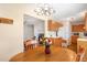 Dining room showcasing wood table set, lighting fixture, and view into living room at 809 Maple Shade Ln, Apex, NC 27502