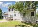 Back exterior features a deck, sliding glass door, and neutral siding at 809 Maple Shade Ln, Apex, NC 27502
