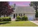Charming single story home with a well manicured lawn, stairway to the front door and attached garage at 809 Maple Shade Ln, Apex, NC 27502