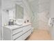 Luxurious bathroom with marble walls, a modern vanity, and a glass-enclosed shower showcasing upscale design at 812 Stradella Rd, Raleigh, NC 27614
