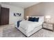 Inviting bedroom features soft lighting, a plush bed with blue accents, and stylish nightstands at 812 Stradella Rd, Raleigh, NC 27614
