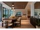 Spacious dining area with modern lighting, overlooking a beautifully landscaped outdoor space at 812 Stradella Rd, Raleigh, NC 27614