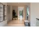 Bright, spacious hallway with modern decor and plants, leading to various rooms at 812 Stradella Rd, Raleigh, NC 27614