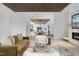 Open-concept living space with modern furnishings, a fireplace, and seamless indoor-outdoor flow at 812 Stradella Rd, Raleigh, NC 27614