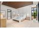 Serene main bedroom with a king bed, neutral tones, and access to an ensuite bathroom at 812 Stradella Rd, Raleigh, NC 27614