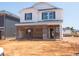 New two-story home featuring a brick foundation and white siding awaiting its landscaping and final touches at 817 Ottawa Dr, Garner, NC 27529