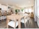 Bright and airy open-concept living and dining area with hardwood floors and modern decor at 817 Ottawa Dr, Garner, NC 27529