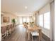 Open-concept living and dining area with hardwood floors, lots of natural light, and modern furnishings at 817 Ottawa Dr, Garner, NC 27529