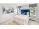 Bright bedroom featuring a queen bed with tufted headboard and plenty of natural light at 825 Ottawa Dr, Garner, NC 27529