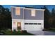 Charming two-story home with white trim, a two-car garage, and landscaped front yard at 825 Ottawa Dr, Garner, NC 27529