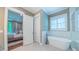 Bright bathroom features a freestanding tub and a doorway to the Primary bedroom suite at 98102 Drummond, Chapel Hill, NC 27517