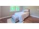 Bright bedroom offers natural light and a cozy atmosphere with hardwood floors and neutral tones at 98102 Drummond, Chapel Hill, NC 27517