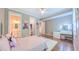 Comfortable bedroom with neutral walls, hardwood floors, and a bed and vanity at 98102 Drummond, Chapel Hill, NC 27517