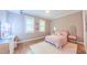 Bedroom featuring hardwood floors, natural light, and vanity area with makeup station at 98102 Drummond, Chapel Hill, NC 27517
